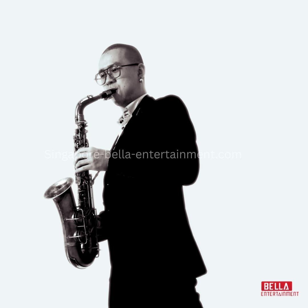 Man in a suit playing a saxophone against a white background, Saxophonist