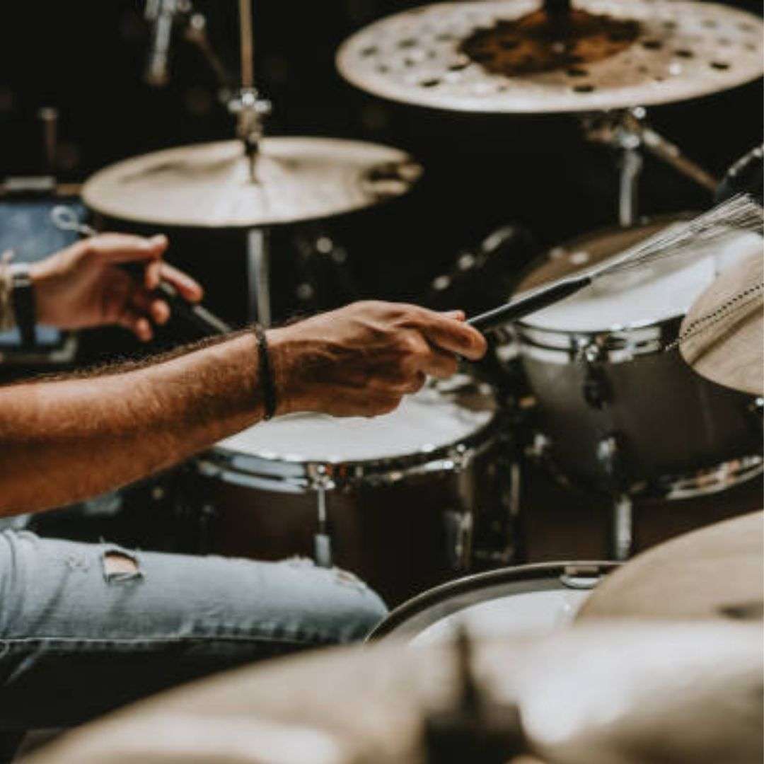 Man playing drums in a recording studio, Musicians