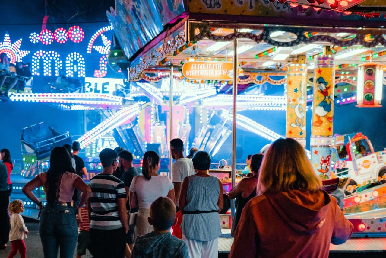 Kids Entertainment: Night funfair with bright lights and amusement rides